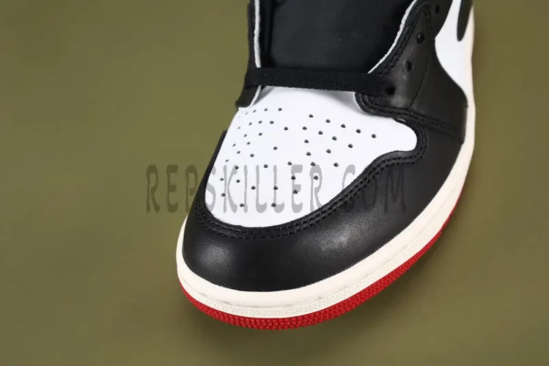 Close-up view of the toe box on the Air Jordan 1 Retro High OG ‘Black Toe Reimagined’ sneaker.