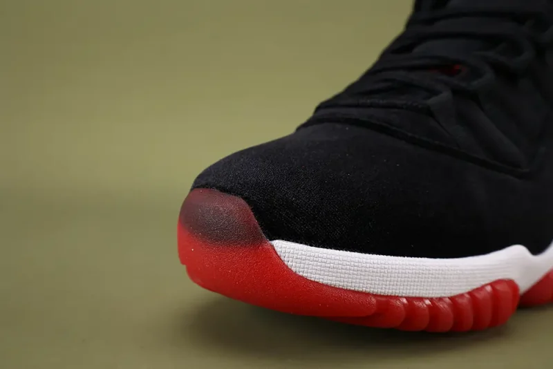 the toe box of the left side of Wmns Air Jordan 11 Retro 'Bred Velvet'